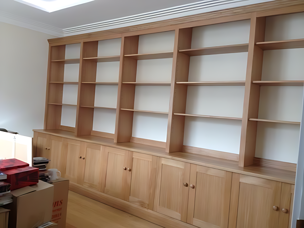 A shelving unit in an office in Horsham fitted by Adam Harman